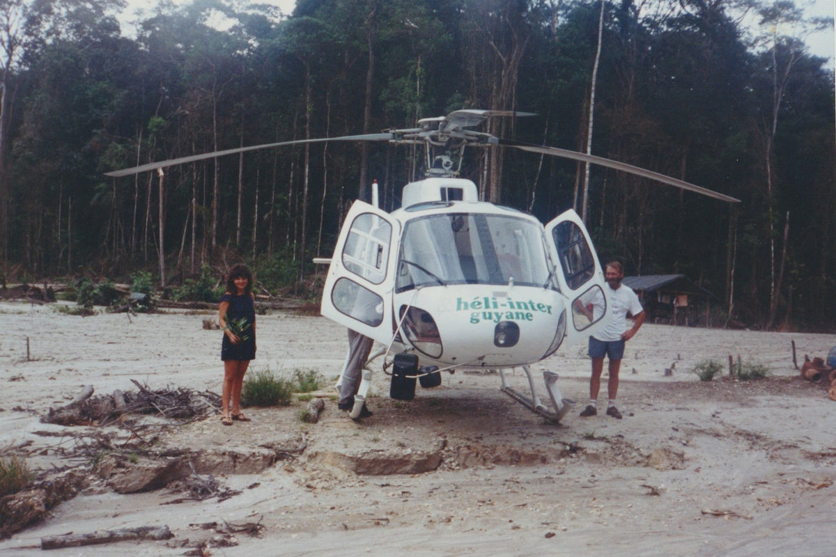 Helicopter with people beside it
